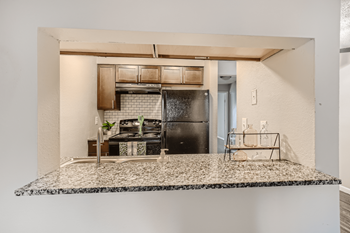 kitchen with breakfast bar at south federal apartments